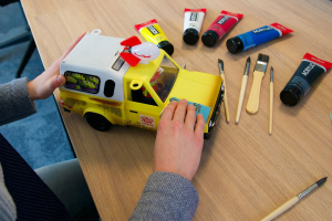 Explore Worlds of Pixar in search of Pizza Planet trucks!